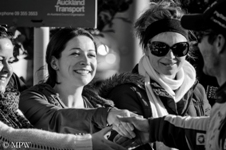 Black and white portrait of young women shaking the hand of Sebastian Lobe at the Auckland Viaduct at the end of the WRC World Rally Championship in Auckland, June 2012